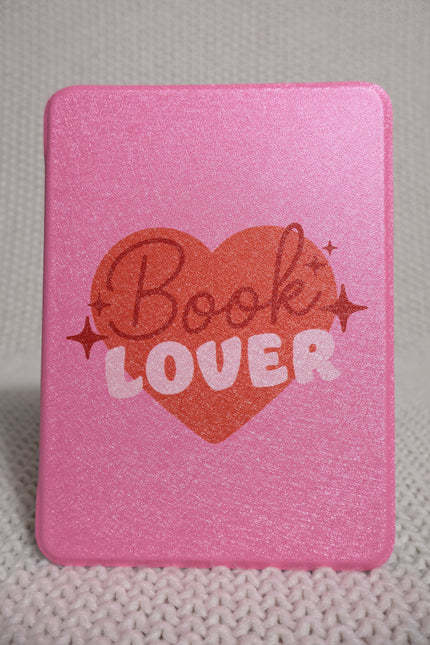 Pink book lover–themed Kindle Paperwhite 11th Gen case designed for a 6.8-inch screen